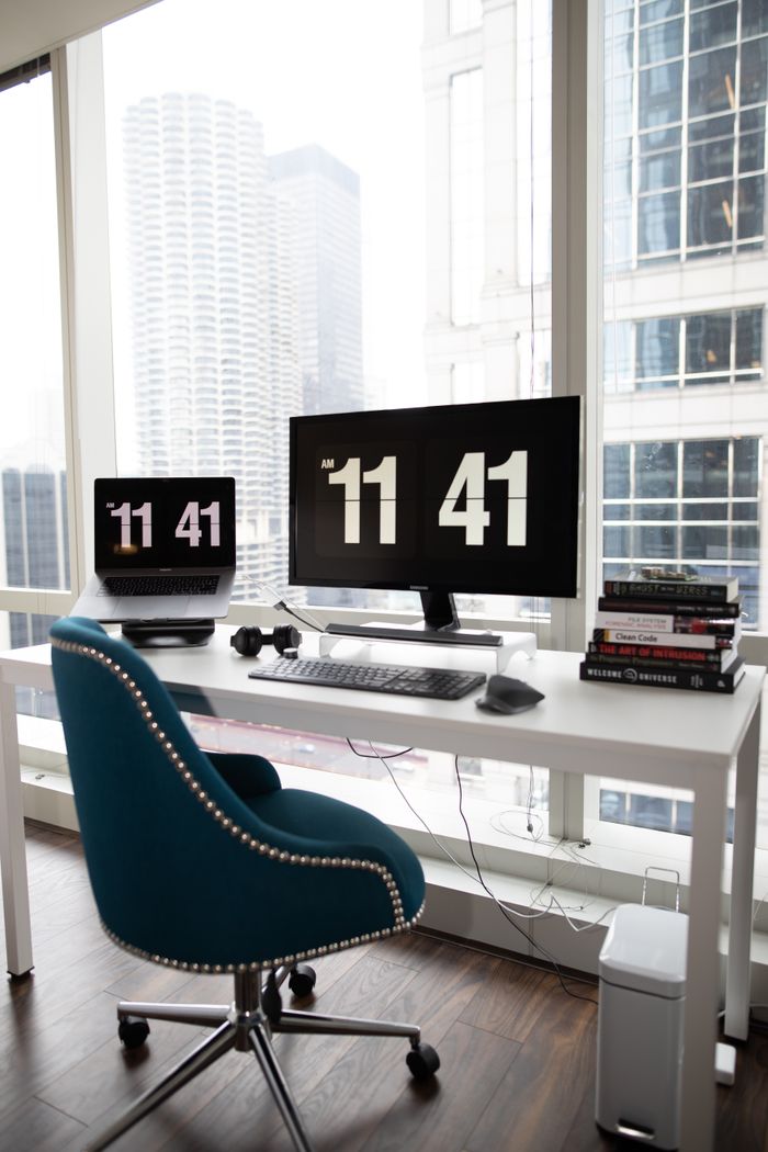 A sleek, contemporary office space with a city view, featuring modern technology and design.